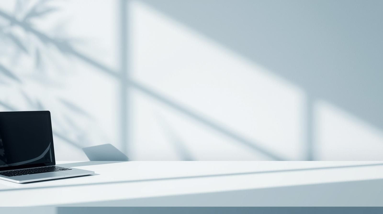 A minimalist white workspace with soft natural diagonal shadows and open negative space in the center, designed to frame CTA text. Subtle blue tones create a clean, professional aesthetic.
